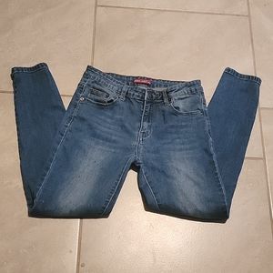 Women's April Girl Skinny Jeans. Sz5. Medium Blue Wash. Frayed at knee.